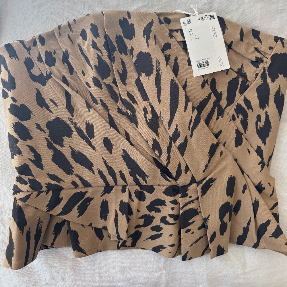 Draped Asymmetric Top